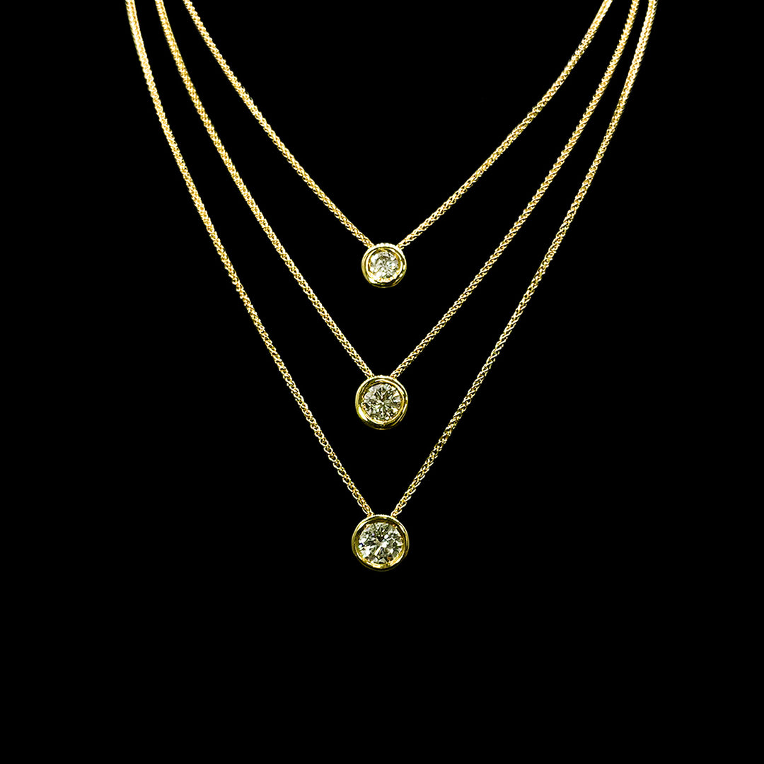 Diamond pendants | Rubover set | Round brilliant | 18ct Yellow Gold