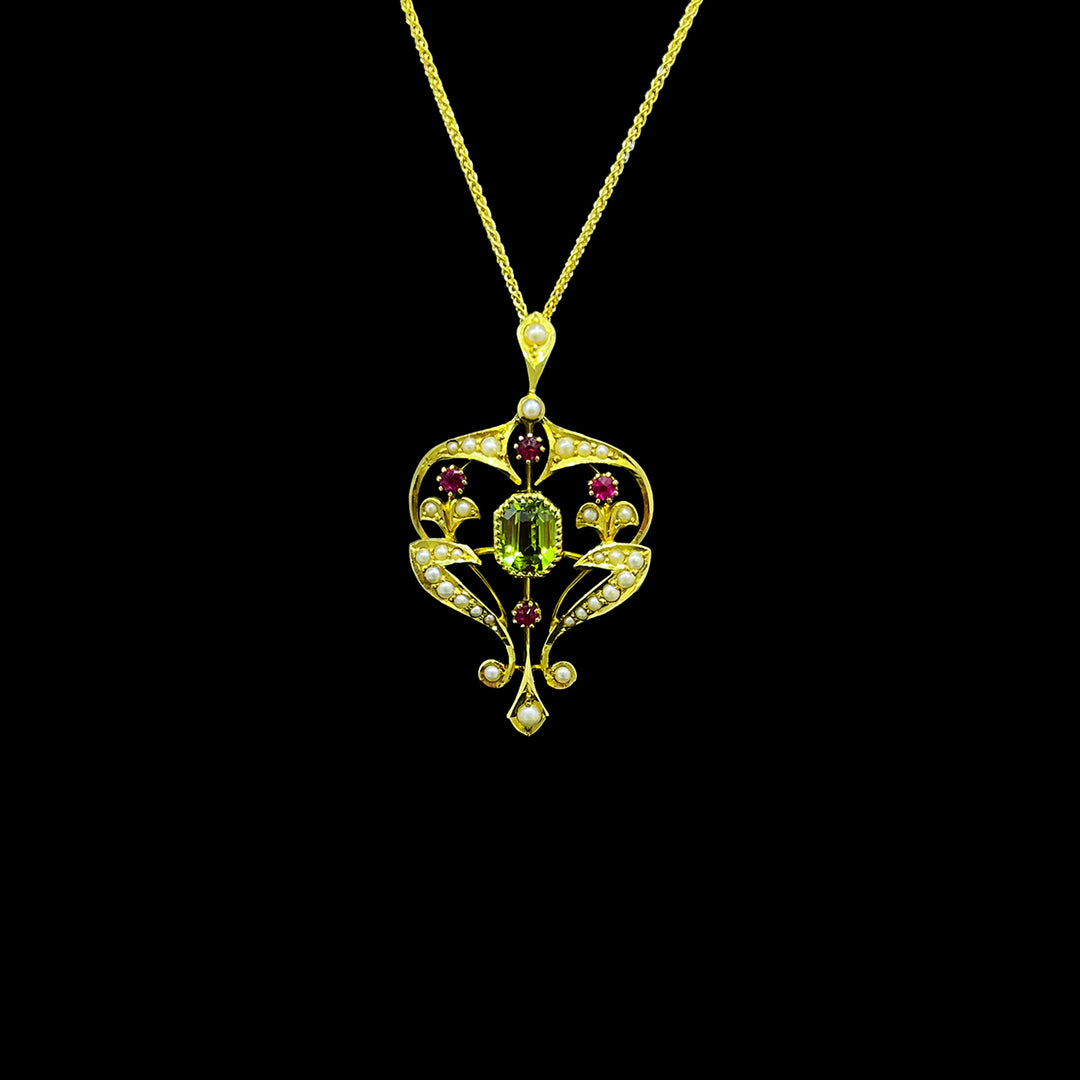 Peridot, ruby and seed pearl pendant | 15ct yellow gold
