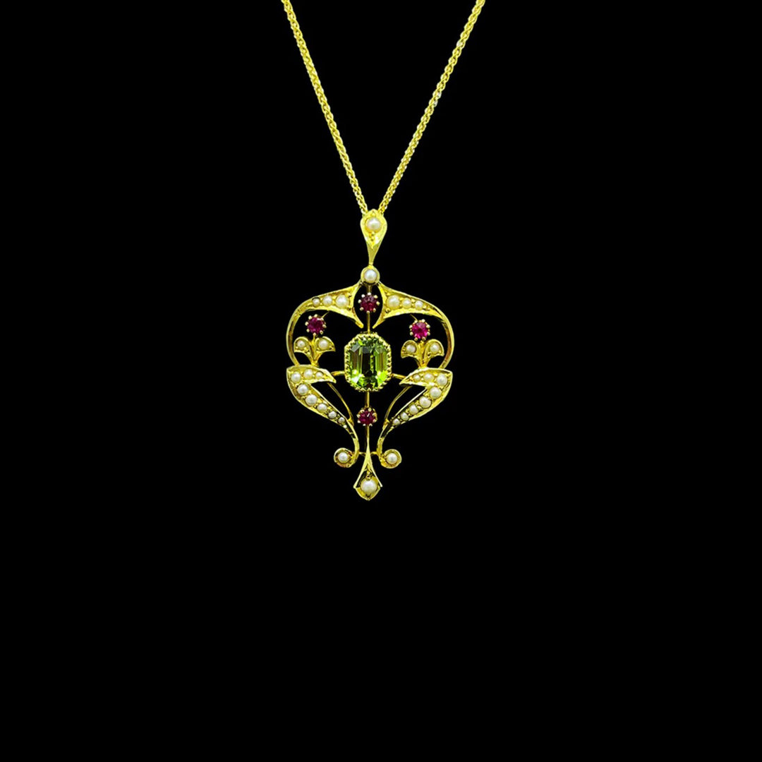 Peridot, ruby and seed pearl pendant | 15ct yellow gold